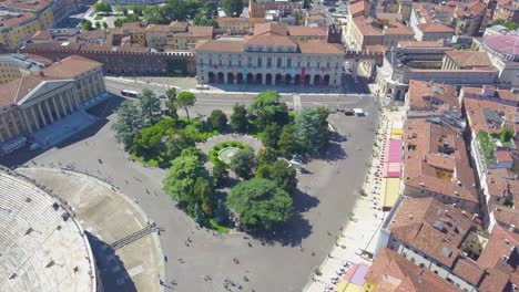 aerial panoramic view of arena di verona, italy. the drone is filming from above bra square and people walking. a view of the arena and the city opens. 4k vieo.