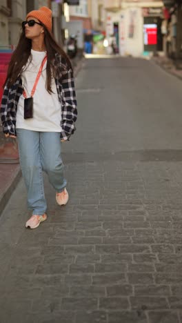 stylish woman walking through city streets