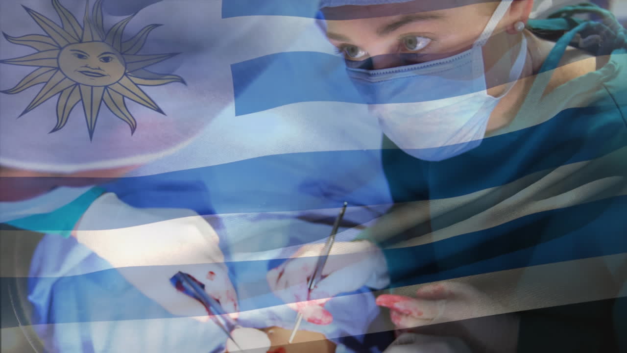 animación de la bandera de uruguay ondeando sobre los cirujanos en la sala de operaciones