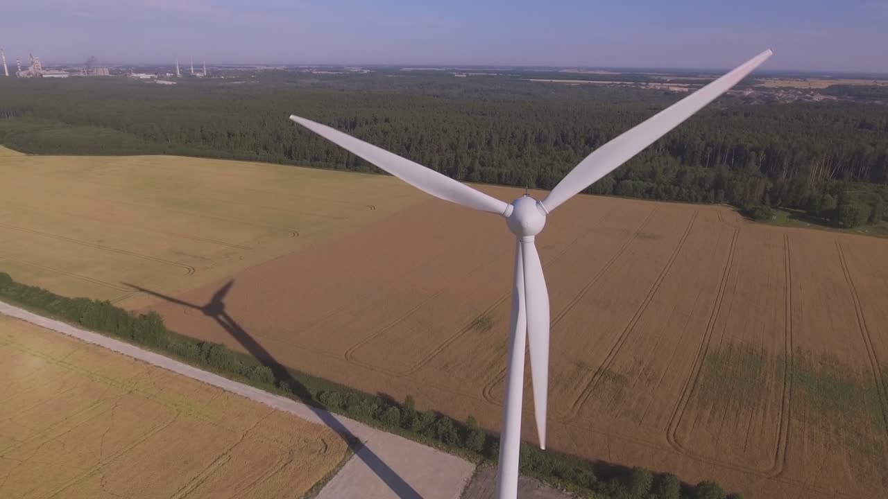 Wind Farm Turbine On A Sunny Summer Day. Aerial Dolly-Out Pedestal-Up