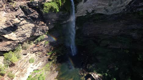 aerial video of waterfall in chapada dos veadeiros, cachoeira simão correia, alto paraíso de goiás, with rainbow, green well, sunny day