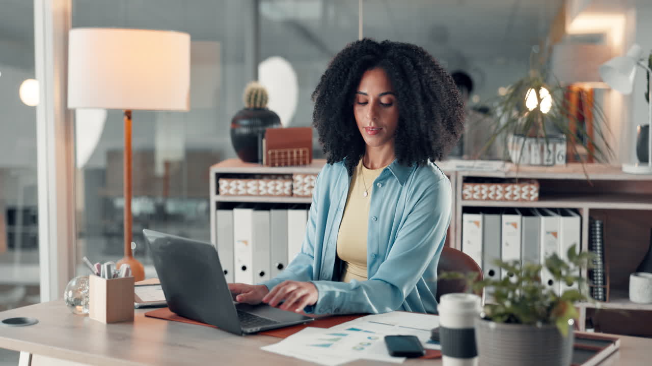 Businesswoman working on laptop in office