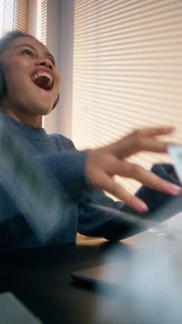 excited woman celebrating online success