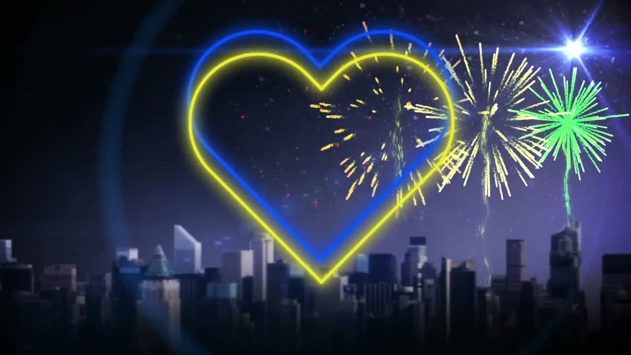 불꽃놀이와 도시 풍경 위에서  ⁇ 박이는 파란색과 노란색 네온 심장의 애니메이션