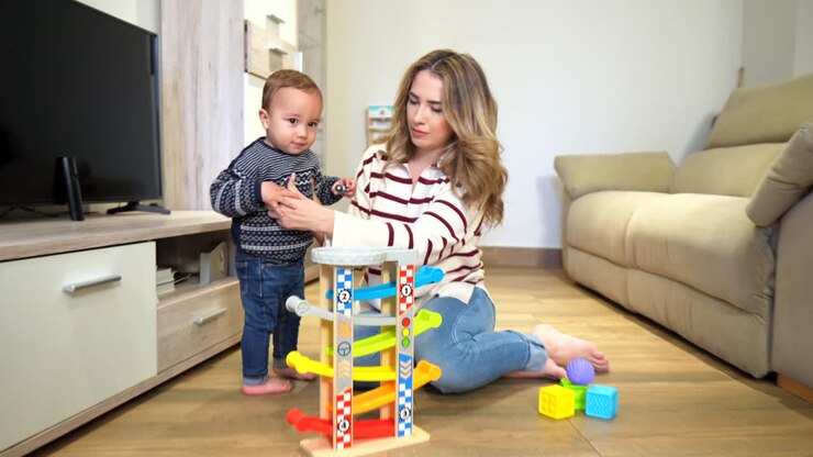 Mother and Child Playing with a Wooden Toy
