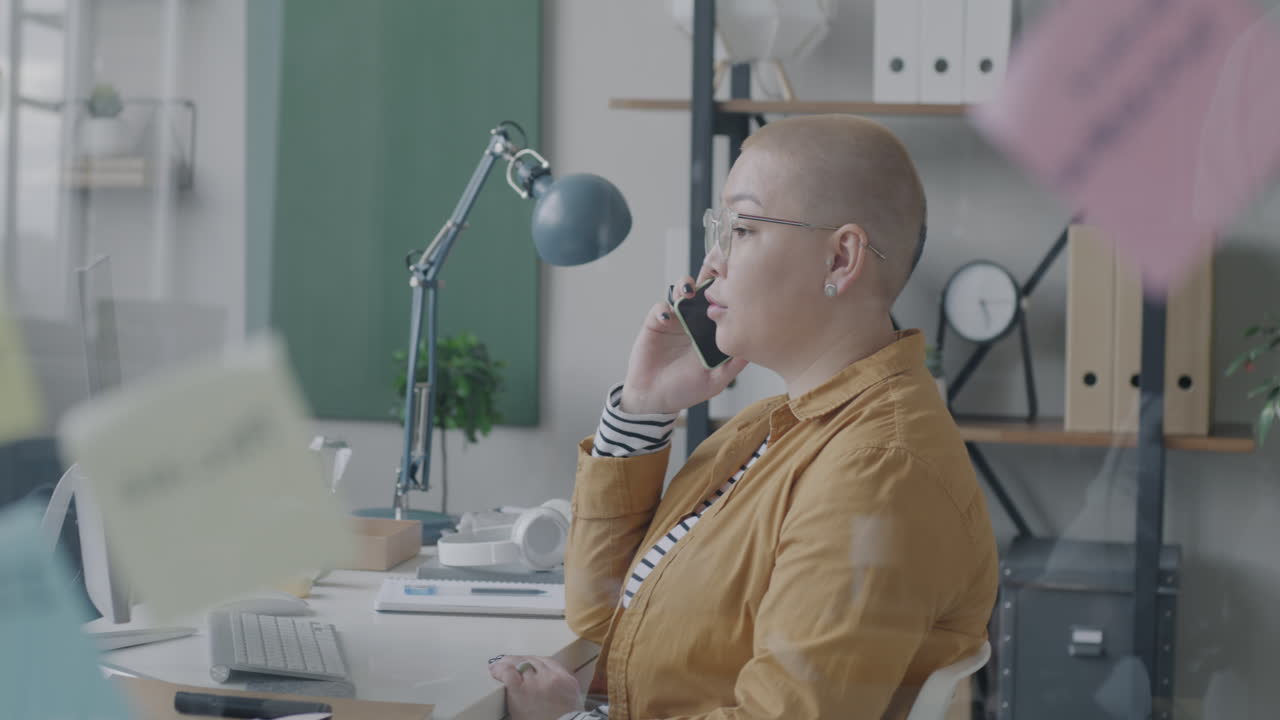 Woman on Phone in Modern Office