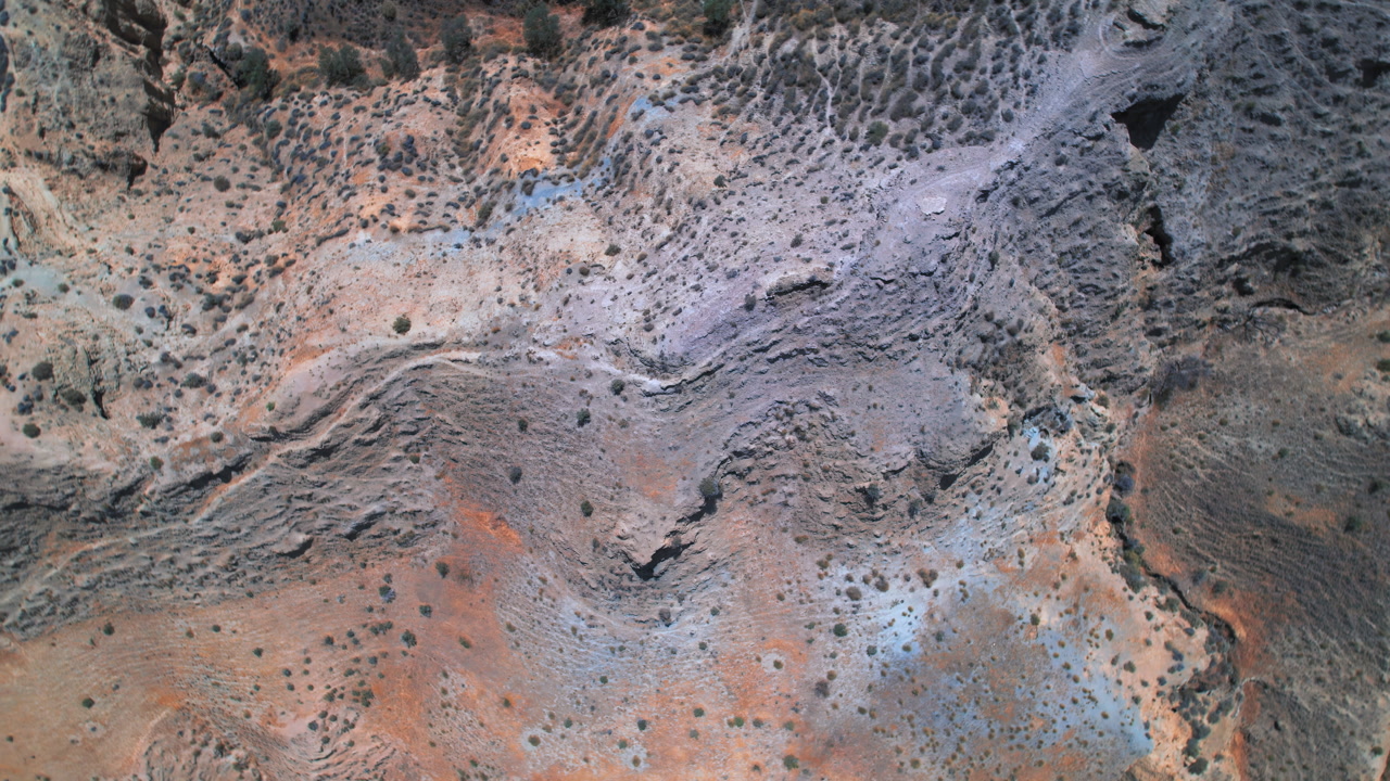 Rotating birdseye view of the rugged terrain in the Gorafe desert, Spain