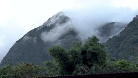Mountains-covered-by-low-clouds-moisture-in-Playa-Chiquita-Panama,-Locked-wide-shot