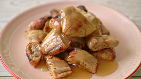 grilled bananas with coconut caramel sauce on plate