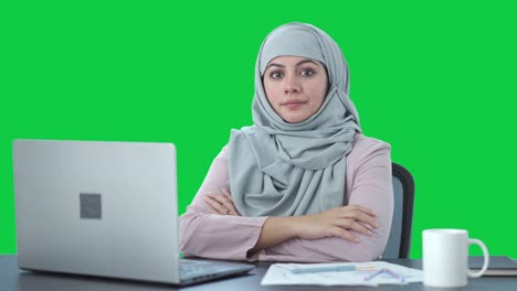 confident muslim businesswoman looking to the camera green screen