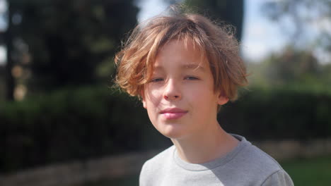 Outdoor-portrait-of-a-teenage-boy-in-sunlight