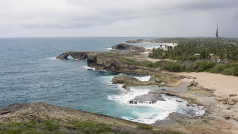 Aerial-View-Of-El-Indio-Cave-Beach-In-La-Piedras-Near-Arecibo,-Puerto-Rico