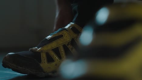 close-up of a cyclist fastening their mountain bike shoes