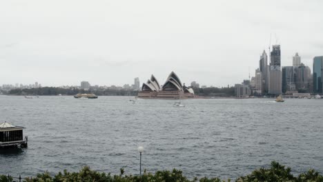 wide view of the sydney opera house during cloudy day - beautiful tourist destination - wide shot