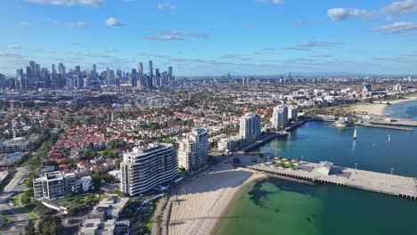 aerial view of port melbourne waterfront promenade and beach with melbourne city skyline in background