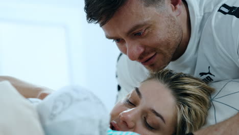 happy parents with their newborn child in hospital. new-made parents with beloved baby. close up.