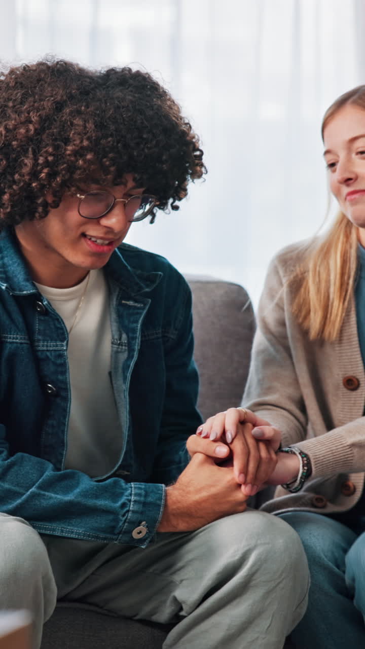 Woman Offers Comfort and Support to Man on Couch