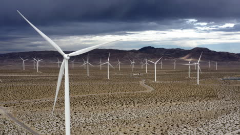 Aerial-view-of-wind-power-turbines,-rainy-day-in-the-southwestern-deserts-of-USA