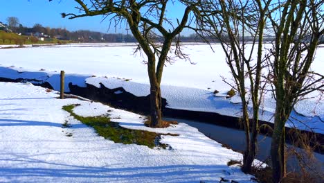 dutch winter countryside floodplain landscape covered with white snow