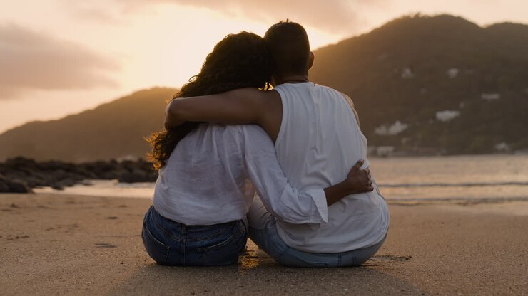 Romantic couple contemplating the sunset