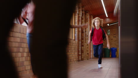 running in school hallway, children with backpacks excitedly heading to class
