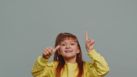 girl child pointing empty place advertising area for commercial text copy space for goods promotion