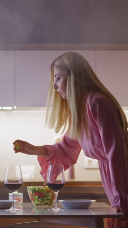 attractive lady looks around and adds venom into red wine of hated husband to revenge at dinner in kitchen with smoke cloud slow motion