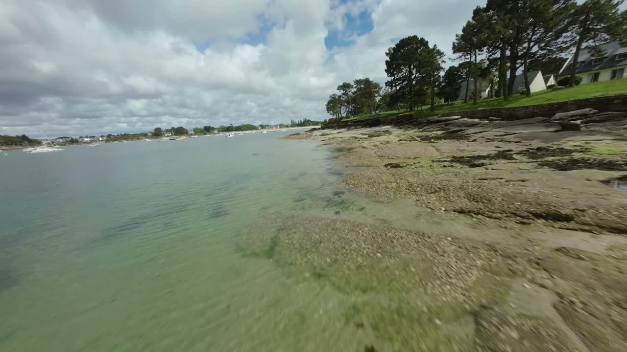 Serene Coastal Scene with Boats and Calm Waters