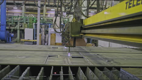 plasma cutting of metal sheets in a factory