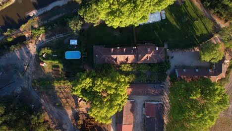 horizontal pan birds eye view rural portuguese country homestead golden hour