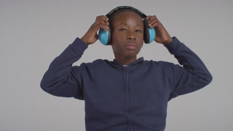 Studio-Shot-Of-Boy-On-ASD-Spectrum-Showing-Sensitivity-To-Loud-Noises-Or-Sounds-Wearing-Ear-Defenders-2