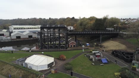 industrial victorian anderton canal boat lift aerial view river weaver wide tilt down rising over