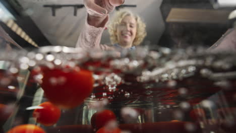 tomatoes being added to boiling water