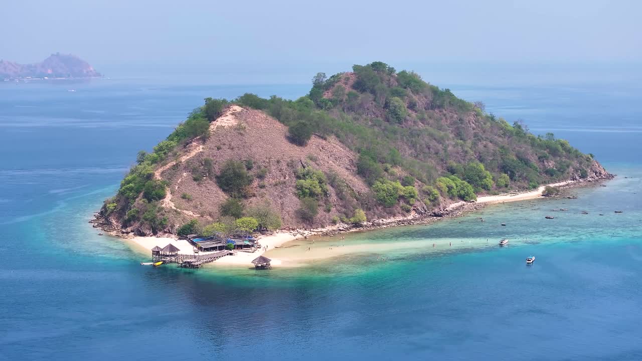 Pulau Kelor Komodo picturesque small island with snorkelling beach, island hopping Indonesia.