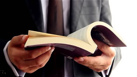 young guy reading a book