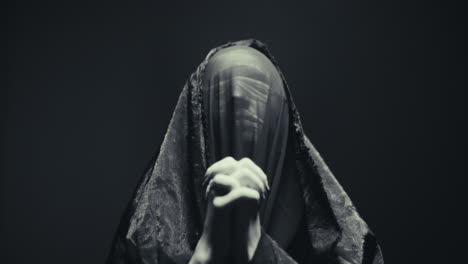 mysterious figure in prayer