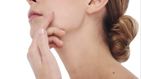 beauty portrait of woman touching beautiful face in slow motion skincare concept on a white background