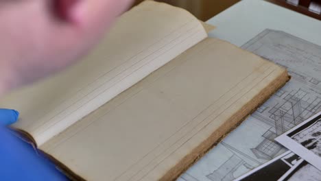 looking through old ledger books for Lemuel Durfee at the Historical Museum and Research library for the Ontario County Research society in Canandaigua New York