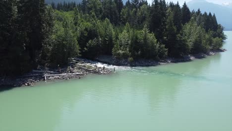 Stream-Flowing-Through-The-Lillooet-Lake-In-Summer-In-BC,-Canada