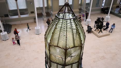 people exploring exhibits in museum atrium