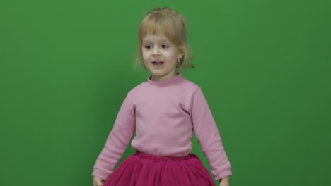 Happy-three-years-old-girl.-Cute-blonde-child.-Dancing-and-make-faces