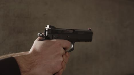 slide of 9mm pistol closing and firing multiple shots