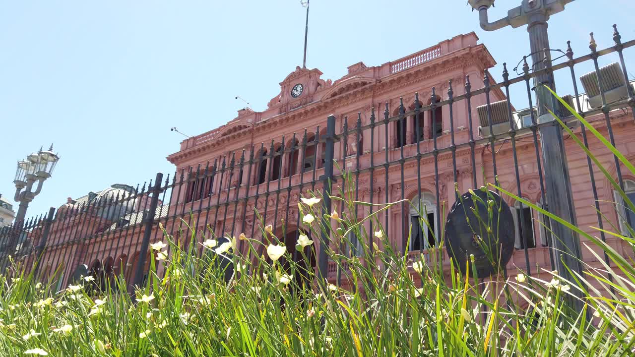 The pink house low angle view over wild greenery, travel landmark of argentina