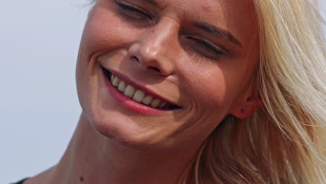 close up shot of pretty face of woman with make up and blond hair,static