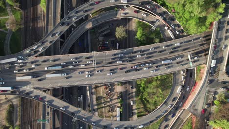 mesmerizing aerial of highway patterns and ramps with slow moving traffic