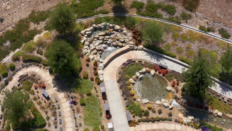 Aerial-descending-and-tilting-up-shot-of-a-relaxing-nature-garden-at-a-California-mortuary