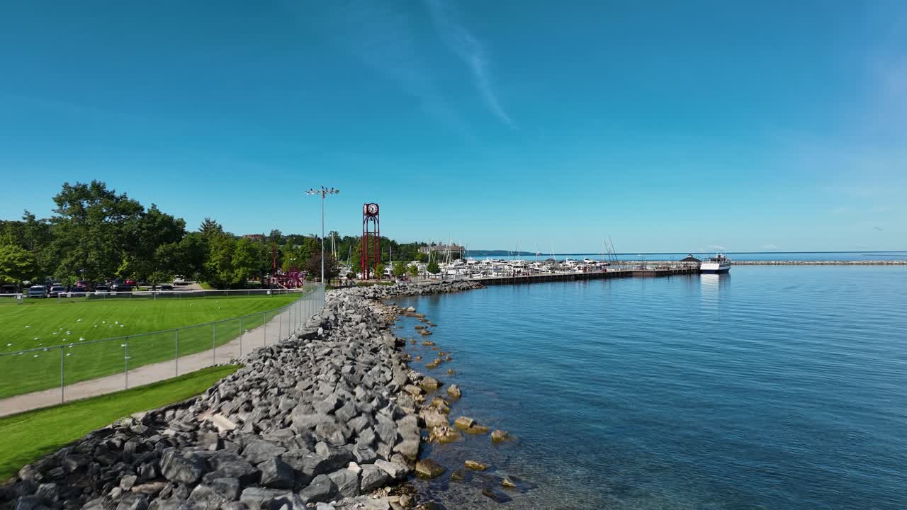 Low height push toward the red clocktower while slowly rising