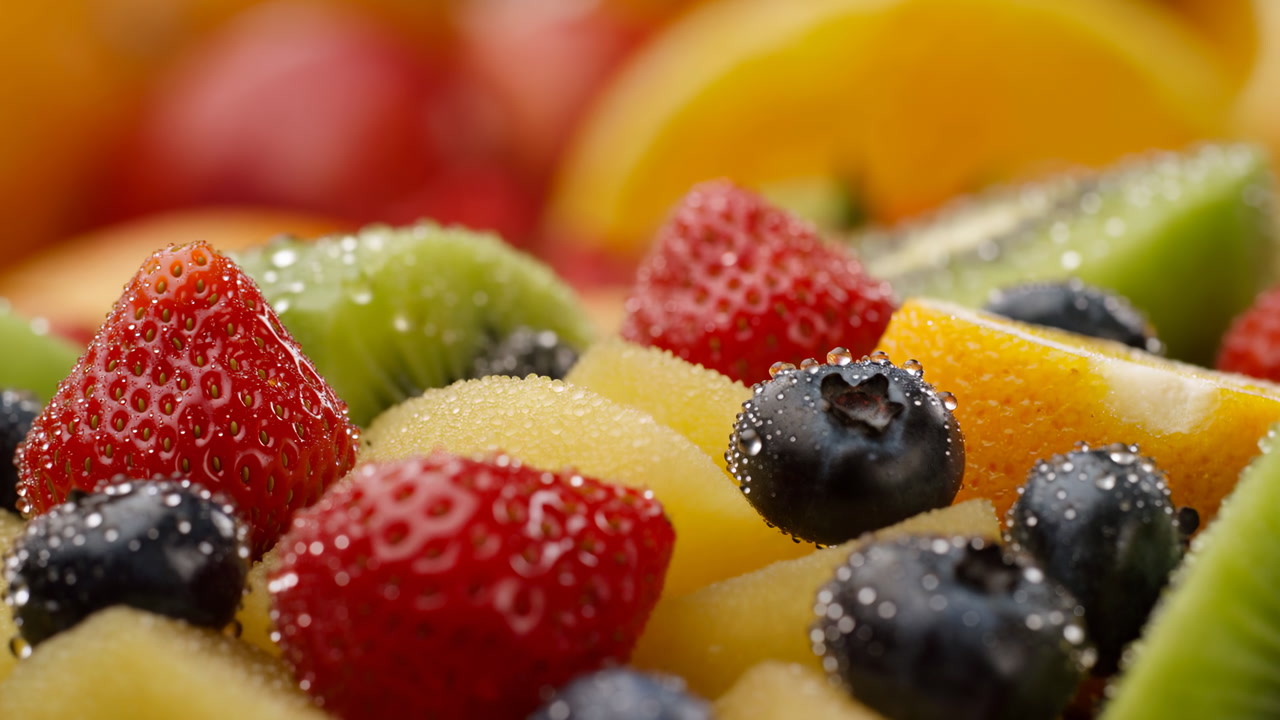 Closeup Colorful Berries With Droplets And Sliced Fruit, Studio Shot Of Strawberry, Blueberry, Kiwi