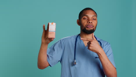 portrait of nurse holding spf50 sunscreen product