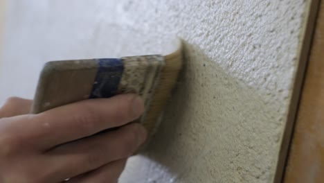 applying plaster to wall